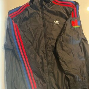Adidas Men's Black Windbreaker with Red and Blue Accents